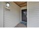 Exterior entryway with a dark door and beach-themed doormat at 202 75Th Ave. N # 5604/5605, Myrtle Beach, SC 29572