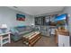 Living room with sofa, coffee table, and large TV at 202 75Th Ave. N # 5604/5605, Myrtle Beach, SC 29572