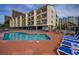 Community pool with multiple lounge chairs at 202 75Th Ave. N # 5604/5605, Myrtle Beach, SC 29572