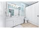 Bathroom with double vanity, white cabinets, and a shower/tub combo at 204 24Th Ave. N, North Myrtle Beach, SC 29582