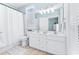 Bathroom with double vanity, white cabinets, and a shower/tub combo at 204 24Th Ave. N, North Myrtle Beach, SC 29582