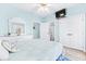 Bedroom with light blue walls, en-suite bathroom, and a queen bed at 204 24Th Ave. N, North Myrtle Beach, SC 29582
