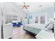 Bright bedroom with king bed, sitting area, and arched window at 204 24Th Ave. N, North Myrtle Beach, SC 29582