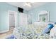 Bedroom with light blue walls, double doors to bathroom, and a queen bed at 204 24Th Ave. N, North Myrtle Beach, SC 29582