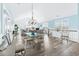 Elegant dining area with glass table and light fixtures at 204 24Th Ave. N, North Myrtle Beach, SC 29582