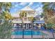 Elevated home with pool and surrounding palm trees at 204 24Th Ave. N, North Myrtle Beach, SC 29582