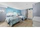 Bedroom with two beds, light blue walls, and access to balcony at 210 75Th Ave. N # 4141, Myrtle Beach, SC 29572