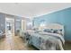 Bedroom with two beds, light blue walls, and ocean view at 210 75Th Ave. N # 4141, Myrtle Beach, SC 29572