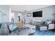 Relax in the condo's comfortable living room, featuring stylish furniture and a large TV at 210 75Th Ave. N # 4141, Myrtle Beach, SC 29572