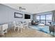 Living room with ocean view, seating area, and dining table at 210 75Th Ave. N # 4141, Myrtle Beach, SC 29572