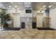 Building lobby with elevators, tiled floors, and potted plant at 210 75Th Ave. N # 4141, Myrtle Beach, SC 29572