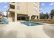 Community pool with lounge chairs and building view at 210 75Th Ave. N # 4141, Myrtle Beach, SC 29572