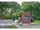 Gathering biking through the entrance to Richmond Park community at 215 Baslow Ct. # 1-B, Myrtle Beach, SC 29572
