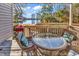 Deck with wicker furniture and glass-top table at 215 Baslow Ct. # 1-B, Myrtle Beach, SC 29572
