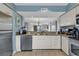 Well-equipped kitchen featuring granite countertops and stainless steel appliances at 215 Baslow Ct. # 1-B, Myrtle Beach, SC 29572