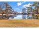 Serene pond view with birds and reflection of buildings at 215 Baslow Ct. # 1-B, Myrtle Beach, SC 29572
