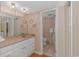 Bathroom with a vanity and toilet, and beige tile at 2511 S Ocean Blvd. # 1601, Myrtle Beach, SC 29577