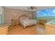 Queen bedroom with light wood floors and coastal decor at 2511 S Ocean Blvd. # 1601, Myrtle Beach, SC 29577