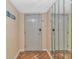Bright condo entry with wood floors and mirrored walls at 2511 S Ocean Blvd. # 1601, Myrtle Beach, SC 29577