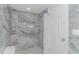 Clean shower with marble-look tile and a glass enclosure at 2511 S Ocean Blvd. # 1601, Myrtle Beach, SC 29577