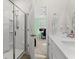 Bathroom with shower and view into bedroom at 3518 Bells Lake Circle # 215, Longs, SC 29568