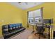 Bright bedroom with a workspace and a fold-out sofa at 3518 Bells Lake Circle # 215, Longs, SC 29568