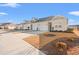 Tan townhouses with garages and landscaping at 3518 Bells Lake Circle # 215, Longs, SC 29568