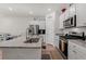 Modern kitchen with granite island and stainless steel appliances at 3518 Bells Lake Circle # 215, Longs, SC 29568