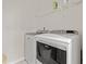 Laundry room with washer, dryer, and shelving at 3518 Bells Lake Circle # 215, Longs, SC 29568
