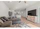 Open concept living space with kitchen and L-shaped sofa at 3518 Bells Lake Circle # 215, Longs, SC 29568