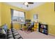 Bright home office with yellow walls, window, and workspace at 3518 Bells Lake Circle # 215, Longs, SC 29568