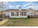 Home's backyard with sunroom and fenced area at 3914 Glenmere Dr., Myrtle Beach, SC 29588