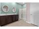Bathroom features double sinks, a glass enclosed shower, and neutral tile flooring for a spa-like feel at 421 Sunforest Way, Conway, SC 29526