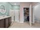 Well-lit bathroom showcasing a vanity, a glass shower, and an open closet for optimal functionality at 421 Sunforest Way, Conway, SC 29526