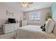 Cozy bedroom with a ceiling fan and a white wicker furniture set creating a relaxing space at 421 Sunforest Way, Conway, SC 29526