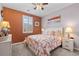 Cozy bedroom features a floral patterned bed and a window with natural light at 421 Sunforest Way, Conway, SC 29526
