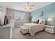 Inviting bedroom with white furniture, complemented by a blue accent wall and natural light at 421 Sunforest Way, Conway, SC 29526