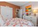 A well-lit bedroom features a comfortable bed, dresser, and closet at 421 Sunforest Way, Conway, SC 29526