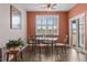 Cozy dining area with seating for four, featuring a bright window and stylish decor at 421 Sunforest Way, Conway, SC 29526