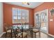 Dining area with seating for four, sliding glass doors for outdoor access, and a ceiling fan at 421 Sunforest Way, Conway, SC 29526