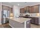 Modern kitchen featuring granite countertops, stainless steel appliances, and an island with a sink at 421 Sunforest Way, Conway, SC 29526