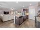Open concept kitchen with island flowing into a spacious living room, perfect for entertaining at 421 Sunforest Way, Conway, SC 29526