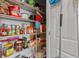 Well-stocked pantry with wire shelving, offering ample storage space for food and supplies at 421 Sunforest Way, Conway, SC 29526