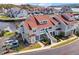 Expansive aerial view shows the beautiful gray condos, red roofs, manicured lawns, and community boat dock at 4396 Baldwin Ave. # 34, Little River, SC 29566