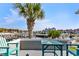Balcony with a palm tree, teal outdoor furniture, and scenic views of the marina at 4396 Baldwin Ave. # 34, Little River, SC 29566
