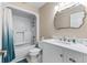 Bright bathroom with large vanity, toilet, shower and bath combo with curtain at 4396 Baldwin Ave. # 34, Little River, SC 29566