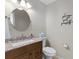 Bathroom with granite vanity, toilet, and decor at 4396 Baldwin Ave. # 34, Little River, SC 29566