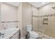 Modern bathroom with a glass shower, soaking tub, neutral tiling, and built in shelves at 4396 Baldwin Ave. # 34, Little River, SC 29566
