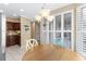 Dining area with chandelier lighting, and a view to the kitchen at 4396 Baldwin Ave. # 34, Little River, SC 29566
