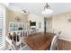 Open concept dining room with wood flooring and view into the living room at 4396 Baldwin Ave. # 34, Little River, SC 29566